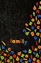 Magnetic letters on black with the word FAMILY Royalty Free Stock Photo
