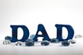 Magnetic letters spelling dad