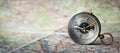 Magnetic old compass on world map.Travel, geography, navigation, tourism and exploration concept wide background. Macro photo. Royalty Free Stock Photo