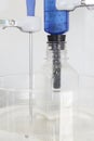 Magnetic stirrer with thermostat sensor detail and bottle