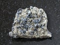magnetite crystals on raw stone on dark