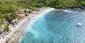 Magnificent aerial panorama up down photo of tropical beach at the end of mountain valley with coconut palms, boats in blue water Royalty Free Stock Photo