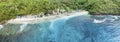 Magnificent aerial panorama up down photo of tropical beach at the end of mountain valley with coconut palms, boats in blue water Royalty Free Stock Photo