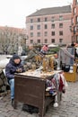 Riga, Latvia, November 2019. Souvenir dealers in the square awaiting buyers.