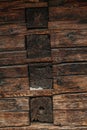 Magnificent background of a textured old wall made of brown wooden beams. Dark old rustic wooden background Royalty Free Stock Photo