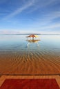 The gazebo for protection from the sun reflected in water