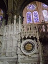 Beautiful statue unique bright stained glass windows and an ancient astronomical clock adorning the Catholic cathedral in Chartres