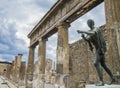 Magnificent bronze statue depicting an old Roman citizen in the archaeological site of Pompeii, Naples, Italy