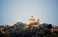 A magnificent building which could be a church stands amongst the trees. Royalty Free Stock Photo