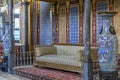 The magnificent chambers of the Sultan in the Ottoman palace with a sofa in an interior decorated with oriental ornaments. Royalty Free Stock Photo