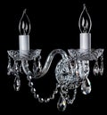 Magnificent chrome sconce on the dark background.