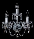 Magnificent chrome sconce on the dark background.