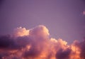 Magnificent colorful clouds in the evening sky. Bright, pink clouds in the sky at sunset. Beautiful evening skyscape. Abstract, pu Royalty Free Stock Photo