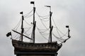 Russia, Lodeinoe Pole, December 2020. Bronze model of a sailing ship against the backdrop of a cloudy sky.