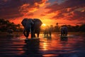 Magnificent elephants roaming the golden african savannah at sunset, radiating a warm glow Royalty Free Stock Photo