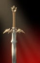 Magnificent fantasy barbarian sword illuminated by a ray of light.