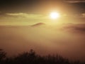 Magnificent heavy mist in landscape. Autumn fogy sunrise in a countryside. Hill increased from fog. Royalty Free Stock Photo