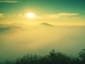 Magnificent heavy mist in landscape. Autumn fogy sunrise in a countryside. Hill increased from fog. Royalty Free Stock Photo