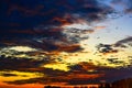 Magnificent Incredible Fiery Sunset over the Silhouette of the Dark line of the Forest Horizon.Beauty and magnificence of nature Royalty Free Stock Photo