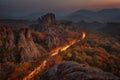 Magnificent night view of the Belogradchik rocks, Bulgaria. Autumn scene, car trails Royalty Free Stock Photo