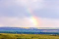 Magnificent rainbow over the forest and steppe Royalty Free Stock Photo