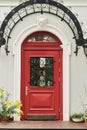 The magnificent red door of a British home. Royalty Free Stock Photo