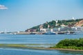 Nizhny Novgorod, Russia, July 6, 2023. Sand spit with seagulls and a view of the city.