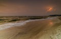 Magnificent seascape at sunset with stones covered seaweeds Royalty Free Stock Photo