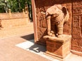 A magnificent sight to behold, a laterite carved elephant stands tall, showcasing .