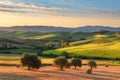 Magnificent spring landscape at sunrise.Beautiful view of typical tuscan farm house Royalty Free Stock Photo