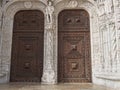 Intricately designed wooden doors framed with sculptures are the entrance to the St Jerome Monastery in Lisbon, Portual.