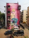 Magnificent street art graffiti of young boy blowing bubble gum in Mahim east Mumbai.