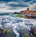 Magnificent summer view of Torre di Bari tower. Stormy morning scene of Sardinia island, Italy, Europe. Wonderful seascape of Medi Royalty Free Stock Photo