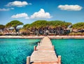 Magnificent summer view of wooden pier on Santa Giulia beach. Romantic morning scene of Corsica island, France, Europe. Splendit M