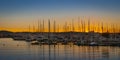 Magnificent sunset color in marina harbor. End of a warm sunny day in Ibiza, St Antoni de Portmany, Spain. Royalty Free Stock Photo