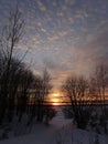 Magnificent sunset on a frosty winter evening on the river.