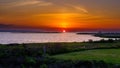 Magnificent sunset illuminates the sky over the water in Nags Head, Outerbanks Royalty Free Stock Photo