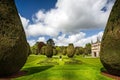 Magnificent topiary and formal garden in front of Lanhydrock Country House in Cornwall, England