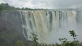 The magnificent Victoria Falls. The Zambezi River flows from the edge of the plateau Royalty Free Stock Photo