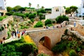 View from above at an ancient bridge and rocky landscape covered by vegetation in Polignano a Mare