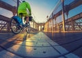 a magnificent view of Brooklyn Bridge with cyclist