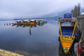 A magnificent view of Kashmir near the lake at Srinagar.A people here using a colourfull boat to attract a visitor Royalty Free Stock Photo