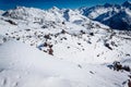 Magnificent view of the snow-white towering mighty mountains Elbrus and the cable ways, ski resort, Kabardinobalkaria, Russia