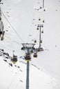 Magnificent view of the snow-white towering mighty mountains Elbrus and the cable ways, ski resort, Kabardinobalkaria, Russia