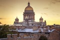 A magnificent view of St. Isaac`s Cathedral at sunset from the rooftops. Top view of the city of St. Petersburg. Beautiful sunset Royalty Free Stock Photo