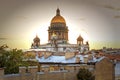 A magnificent view of St. Isaac`s Cathedral at sunset from the rooftops. Top view of the city of Petersburg. Beautiful sunset Royalty Free Stock Photo