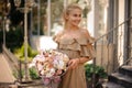 magnificent view of young blonde woman with gorgeous bouquet of flowers in her hands Royalty Free Stock Photo