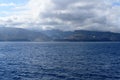 Magnificent views from the high seas with a beautiful enraged sky as a background the island of La Gomera. April 15, 2019. La