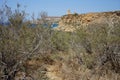 Magnificent views of Riviera Beach and the small watchtower Ghajn Tuffieha Tower, limits of Mgarr, Mellieha, Malta. Royalty Free Stock Photo