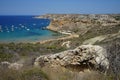 Magnificent views of Riviera Beach and the small watchtower Ghajn Tuffieha Tower, limits of Mgarr, Mellieha, Malta.